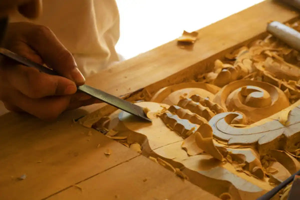 Carving details into wood panels with a circular cutter