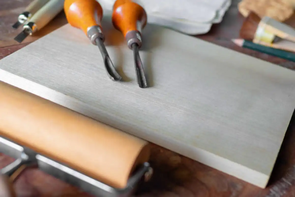 Carving tools are placed on the stone slabs