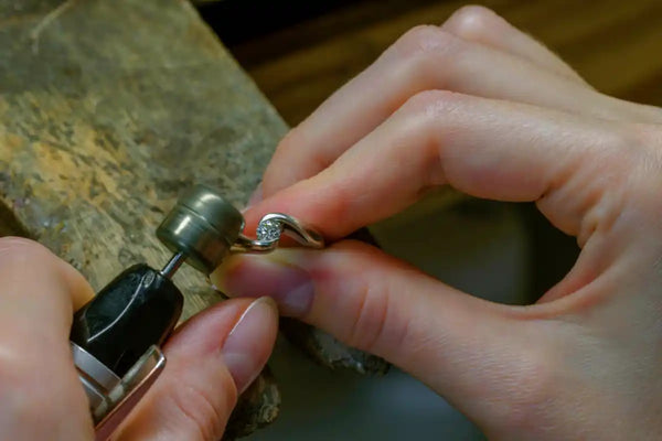 Hand-engraved metal ring portion of the ring