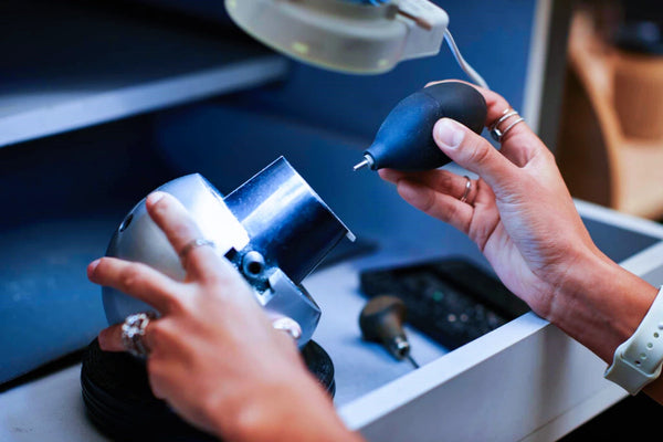 artisan focuses bringing out brilliance jewel using specialized tools care